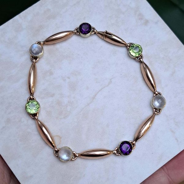 Edwardian Antique Suffragette Peridot and Amethyst Bracelet, 15ct yellow gold bracelet set with gemstones symbolic of the suffragette movement; moonstone, peridot and amethyst