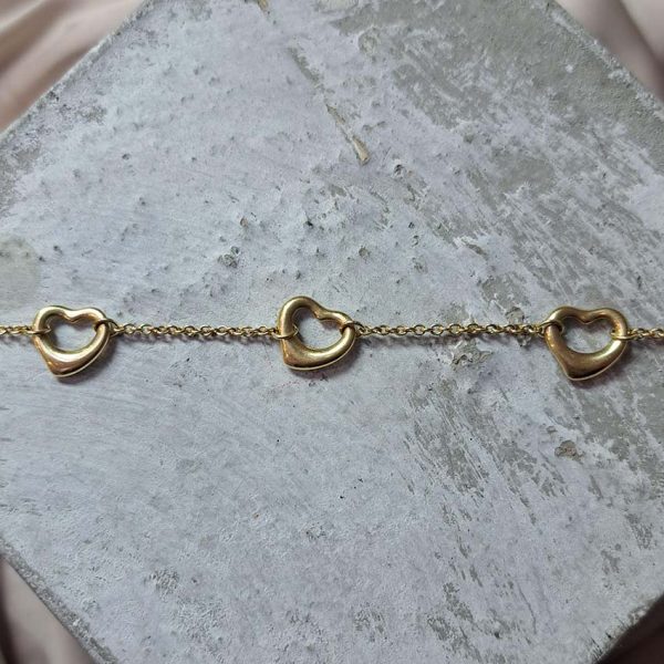 Vintage Tiffany and Co Elsa Peretti Open Hearts Gold Bracelet with three hearts