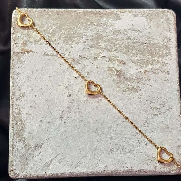 Vintage Tiffany and Co Elsa Peretti Open Hearts Gold Bracelet with three hearts