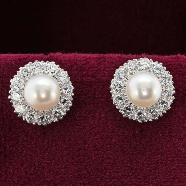 Vintage Pearl and Diamond Cluster Stud Earrings, 8mm white silvery natural saltwater cultured pearls surrounded by 2.40 carats of round brilliant-cut diamonds in 18ct gold