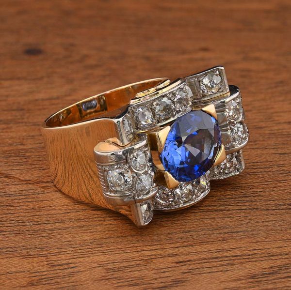 Art Deco 5.60ct Verneuil Sapphire and 3.20ct Diamond Tank Ring, 5.60ct oval royal blue lab made Verneuil sapphire within 3.20ct surround of old mine-cut diamonds in 18ct yellow gold geometric design. Circa 1925