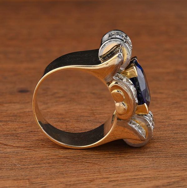 Art Deco 5.60ct Verneuil Sapphire and 3.20ct Diamond Tank Ring, 5.60ct oval royal blue lab made Verneuil sapphire within 3.20ct surround of old mine-cut diamonds in 18ct yellow gold geometric design. Circa 1925