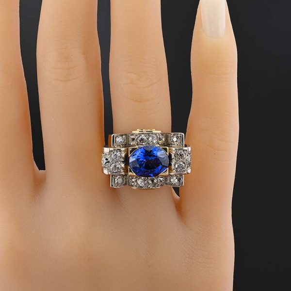 Art Deco 5.60ct Verneuil Sapphire and 3.20ct Diamond Tank Ring, 5.60ct oval royal blue lab made Verneuil sapphire within 3.20ct surround of old mine-cut diamonds in 18ct yellow gold geometric design. Circa 1925
