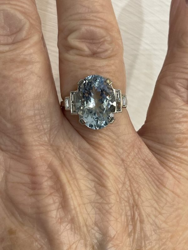 6.50ct Oval Cut Aquamarine and Baguette Diamond Ring, 6.50 carat oval mixed-cut aquamarine flanked by stepped baguette-cut diamonds in platinum