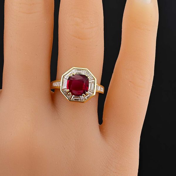 Vintage 1.50ct Ruby and 1.60cts F VVS Diamond Cluster Engagement Ring, cushion-shaped ruby surrounded by trapezoid diamonds in octagonal design in 18ct yellow gold with tapering baguette-cut diamonds to the shoulders. Circa 1970