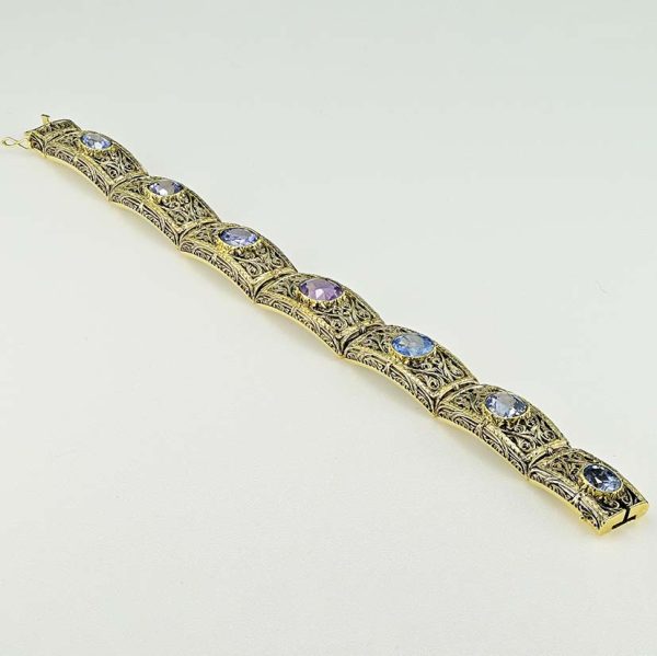 Vintage 19.45ct Natural No Heat Ceylon Sapphire Panel Link Bracelet, Ornate silver topped gold panels with seven natural unheated Ceylon sapphires, central sapphire is lovely fleur de lys Lavender purple colour. Circa 1935