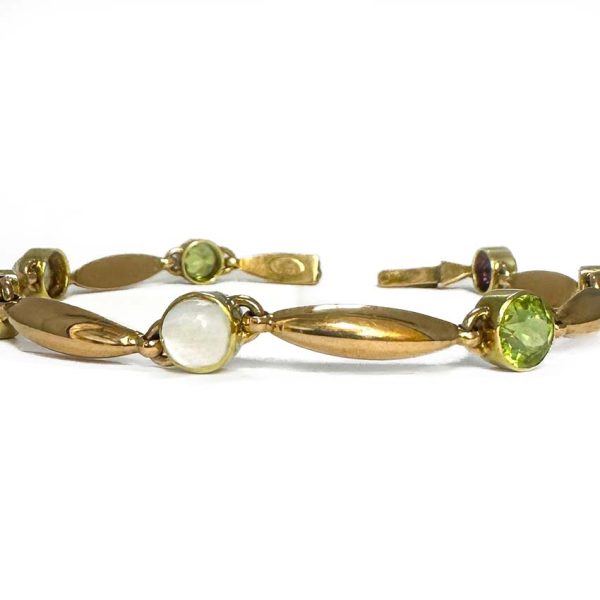 Edwardian Antique Suffragette Peridot and Amethyst Bracelet, 15ct yellow gold bracelet set with gemstones symbolic of the suffragette movement; moonstone, peridot and amethyst