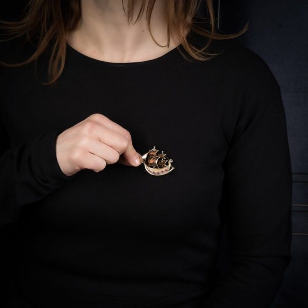 Gold sailing ship brooch with rubies.