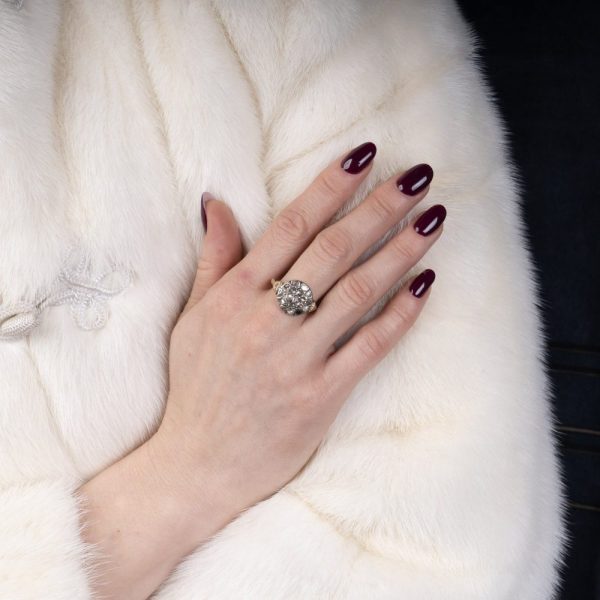 Victorian diamond cluster ring in gold and silver.