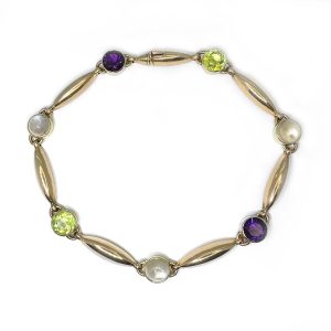 Edwardian Antique Suffragette Peridot and Amethyst Bracelet, 15ct yellow gold bracelet set with gemstones symbolic of the suffragette movement; moonstone, peridot and amethyst