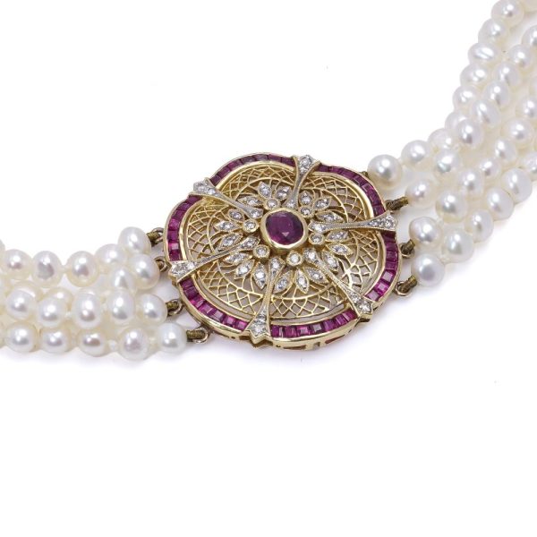 Diamond, ruby and pearl choker necklace in gold.