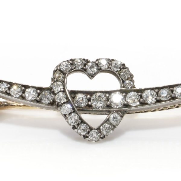 Victorian heart and arrow diamond brooch in gold and silver.