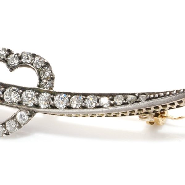 Victorian heart and arrow diamond brooch in gold and silver.