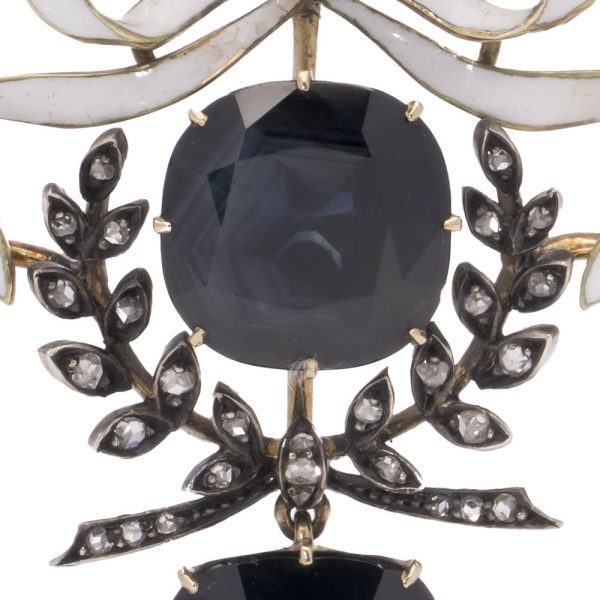 Antique diamond and sapphire pendant in gold and silver.