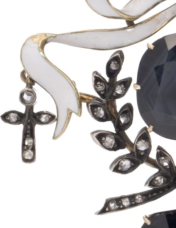 Antique diamond and sapphire pendant in gold and silver.