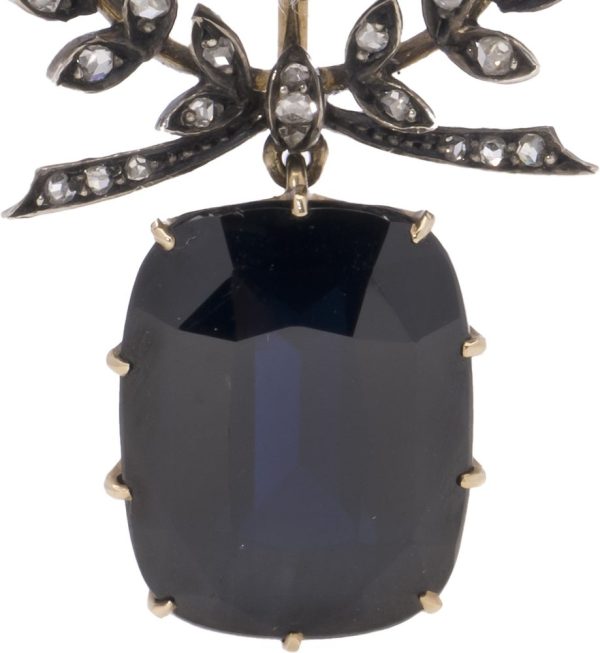Antique diamond and sapphire pendant in gold and silver.
