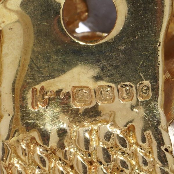 Diamond and gemstone brooch in gold.