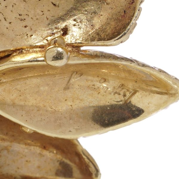 Diamond and gemstone brooch in gold.