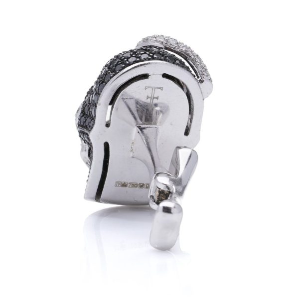 Theo Fennell gold cufflinks with black and white diamonds.