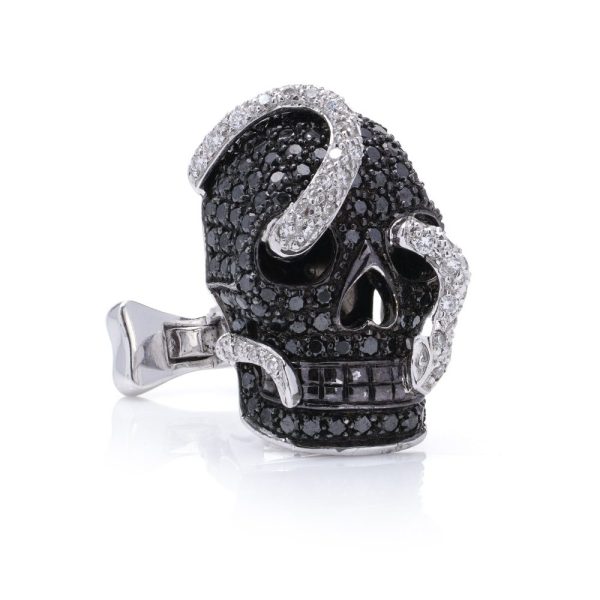 Theo Fennell gold cufflinks with black and white diamonds.