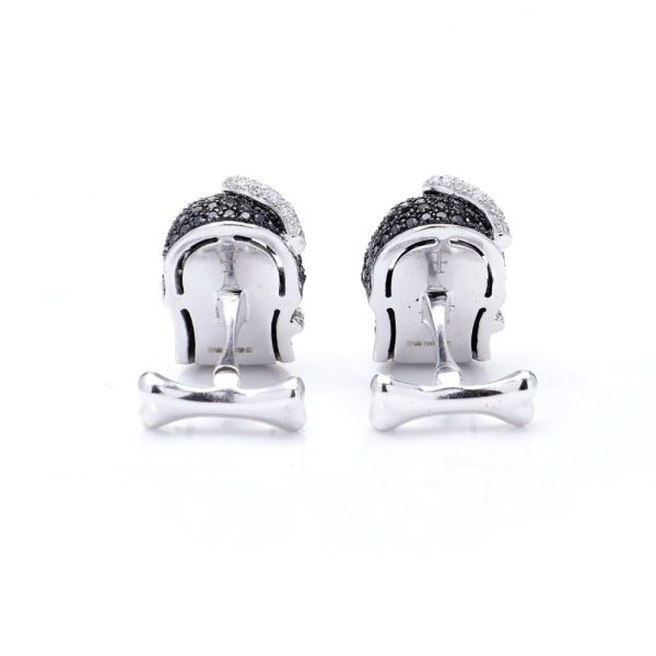 Theo Fennell gold cufflinks with black and white diamonds.
