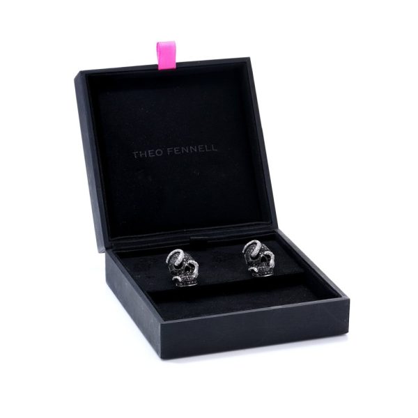 Theo Fennell gold cufflinks with black and white diamonds.