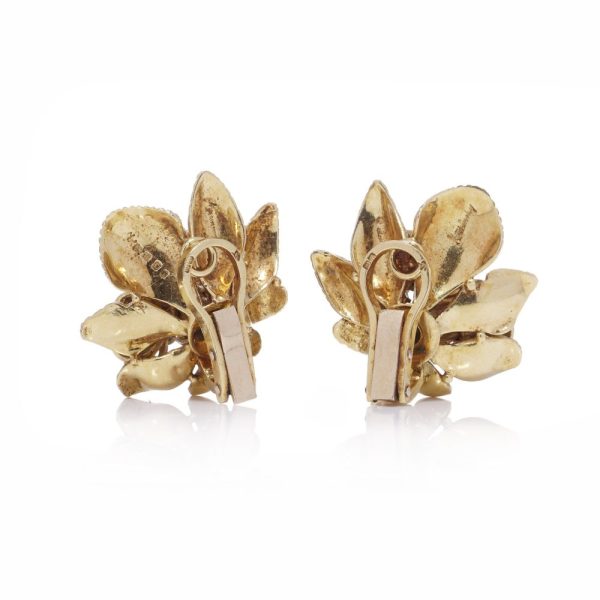 Vintage Kutchinsky gold flower earrings with gemstones.