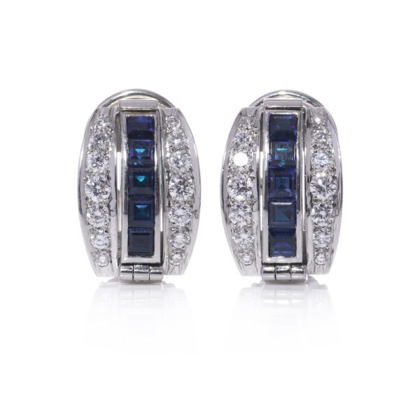 Reversible earrings with sapphires, emeralds and diamonds in platinum.