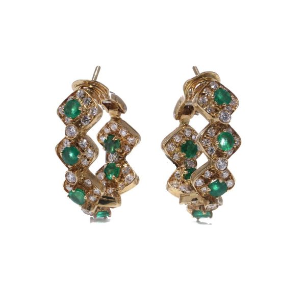 Emerald and diamond earrings in yellow gold.