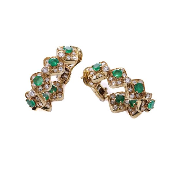 Emerald and diamond earrings in yellow gold.