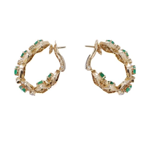 Emerald and diamond earrings in yellow gold.