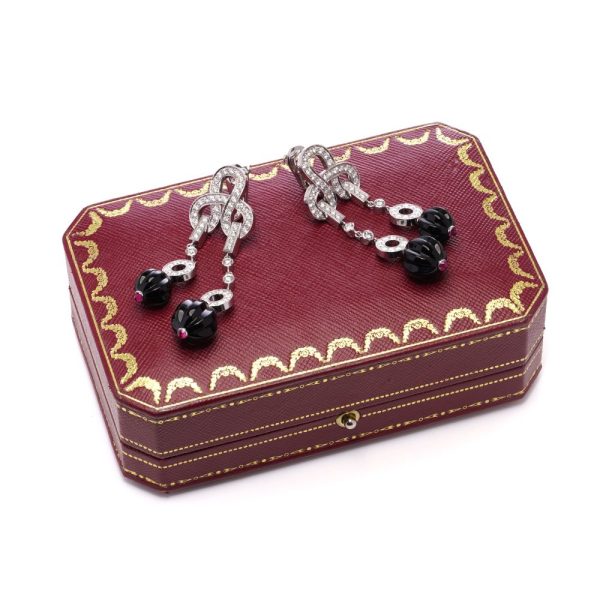 Cartier white gold earrings with diamonds, sapphires and rubies.