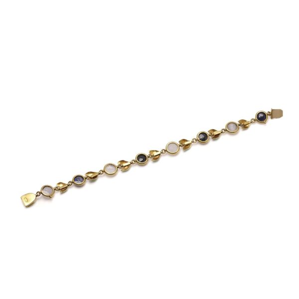 Victorian gold bracelet with enamel, sapphires and moonstones.