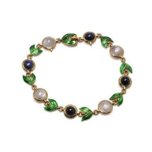 Victorian gold bracelet with enamel, sapphires and moonstones.