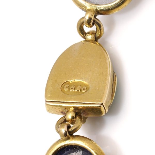 Victorian gold bracelet with enamel, sapphires and moonstones.