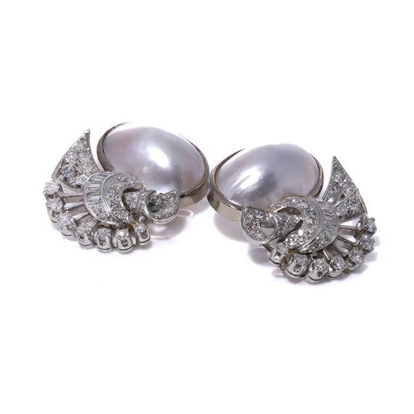 Vintage pearl and diamond earrings in platinum.