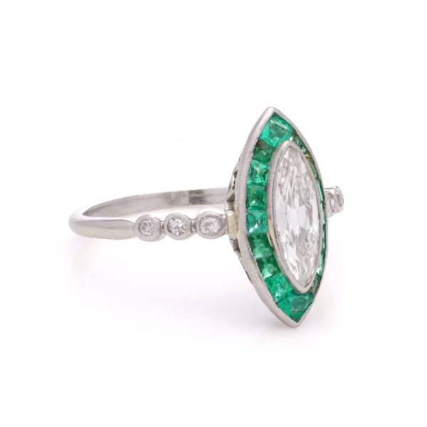 Vintage diamond and emerald ring in platinum.