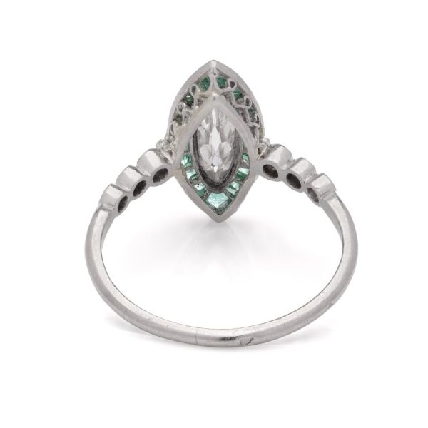 Vintage diamond and emerald ring in platinum.