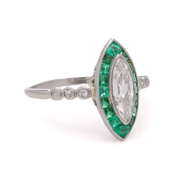 Vintage diamond and emerald ring in platinum.
