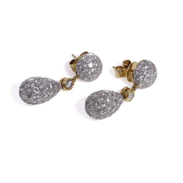 Diamond drop earrings in yellow and white gold.