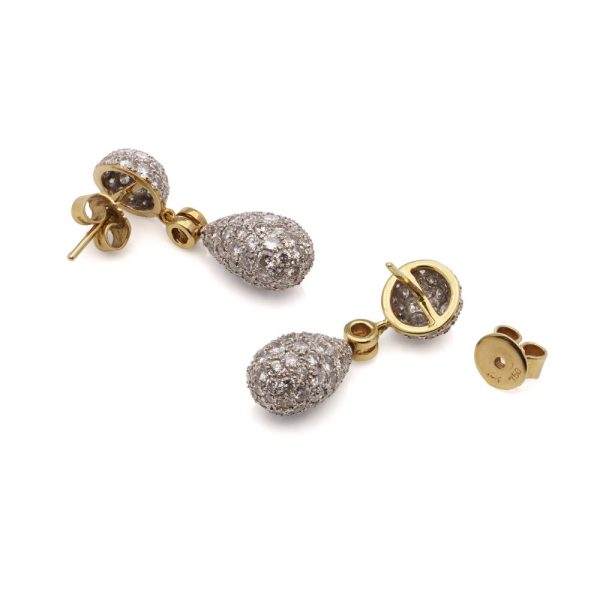 Diamond drop earrings in yellow and white gold.