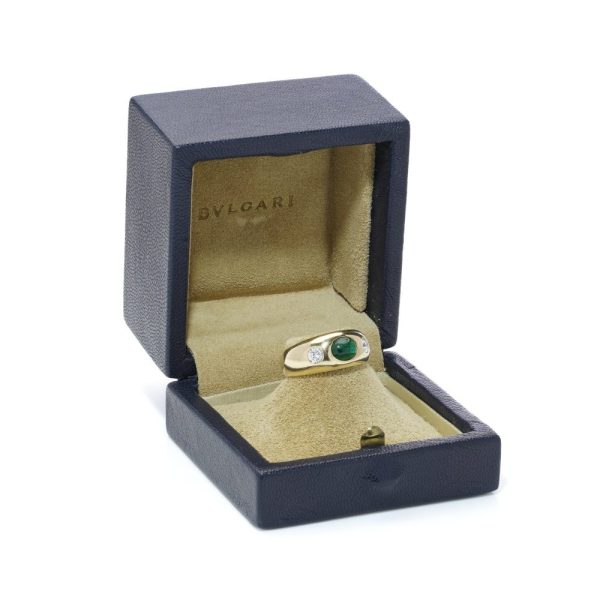Bvlgari three-stone ring in gold with emerald and diamonds.