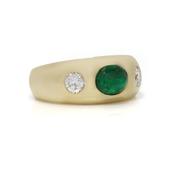 Bvlgari three-stone ring in gold with emerald and diamonds.
