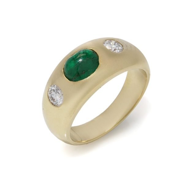 Bvlgari three-stone ring in gold with emerald and diamonds.