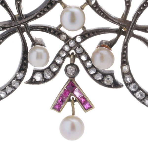 Victorian diamond, ruby and pearl pendant in gold and silver.
