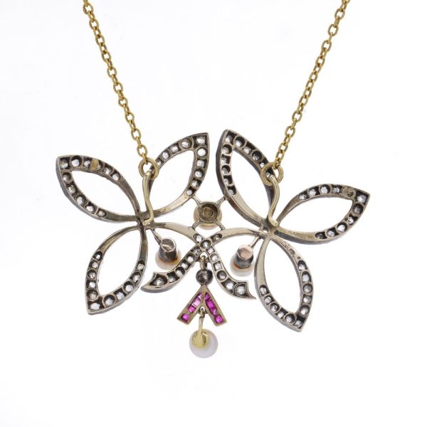 Victorian diamond, ruby and pearl pendant in gold and silver.