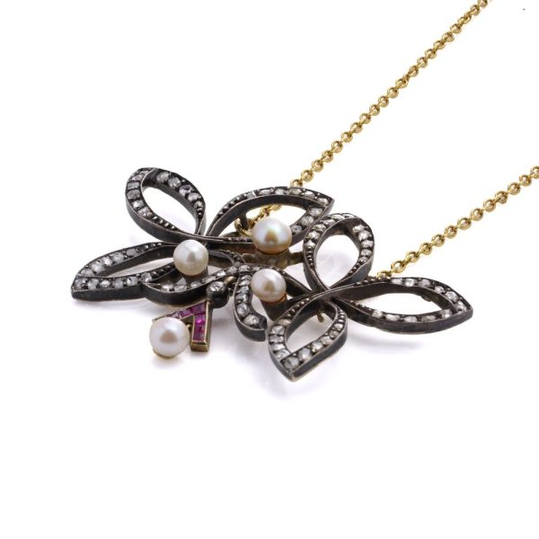 Victorian diamond, ruby and pearl pendant in gold and silver.