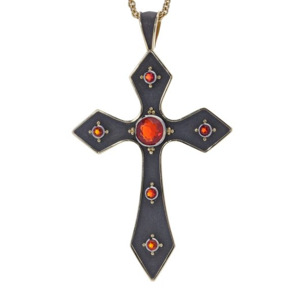 Gold cross pendant featuring vivid fire opals.