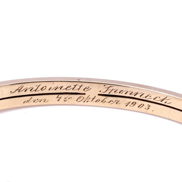 Edwardian gold bangle with diamonds, sapphires and a ruby.