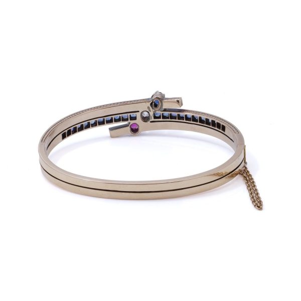 Edwardian gold bangle with diamonds, sapphires and a ruby.
